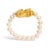 Power and poise coil at your fingertips in this sculpted talisman: a polished 18K yellow gold dragon perched above a band...