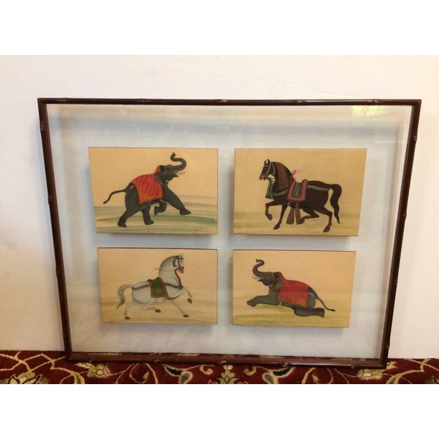 A pair of framed small paintings cleverly mounted as collections of four between two pieces of transparent glass. This...