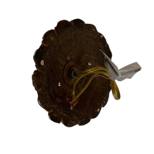 What a stunning light fixture! Incredible ornate brass arm gives dramatic style. Frosted cut glass globe shade features a...