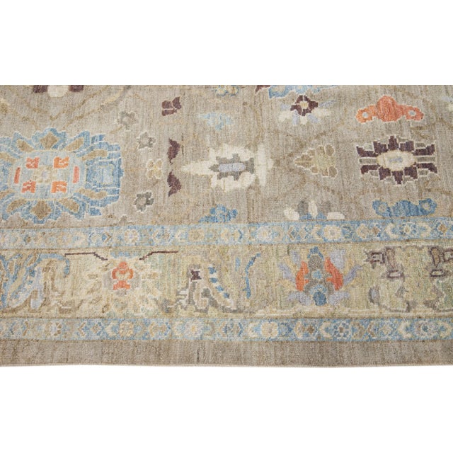 Beautiful modern Sultanabad hand-knotted wool rug with a beige color field. This rug has a designed frame with orange,...