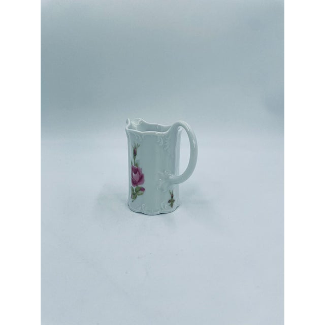 A milk jug from the renowned German manufacturer Rosenthal's Classic Rose line, part of the iconic and incredibly subtle...