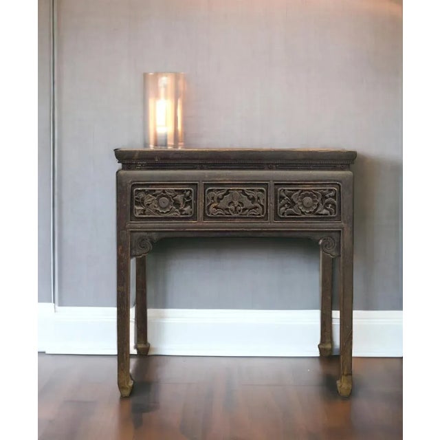 Featuring 3 beautifully hand carved drawer fronts, this gorgeous antique table is constructed traditional tenon and...