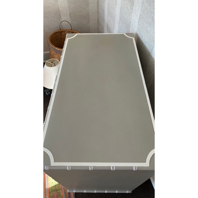 somerset bay small longboat key chest in grey/ taupe with accents on drawers. 5 drawers; 2 small and 3 large. an...