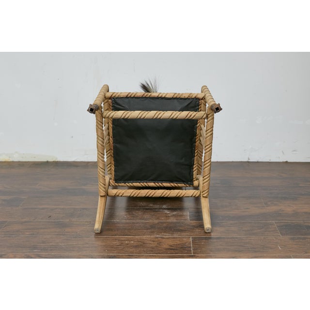A late Victorian oak barley twist armchair with zebra hide upholstery and ball and claw feet. This late Victorian oak...