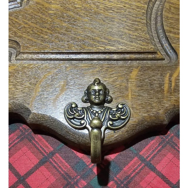 In excellent condition with perfect angel-shaped brass handles.