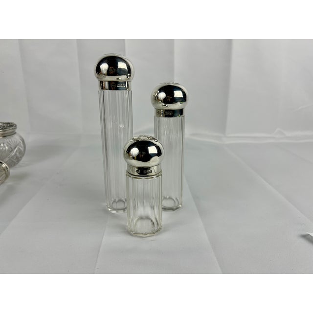 This elegant three-piece dresser jar set, crafted by Henry Greaves, exemplifies the refinement of early 20th-century...