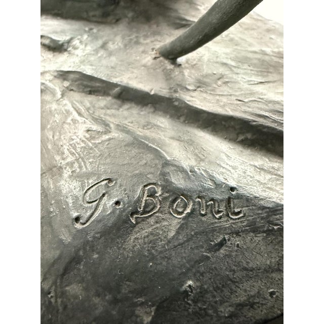 Sculpture "Archer" in bronze patinated plaster signed by G. Boni and published by Kara France. This piece has an...