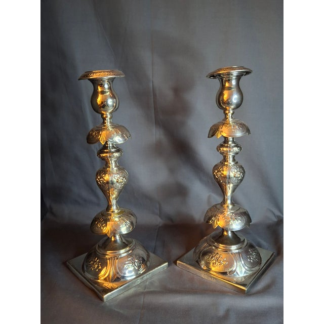 Design Significance & Aesthetic Appeal This exceptional pair of Shabbat candlesticks elevates historical utility into a...