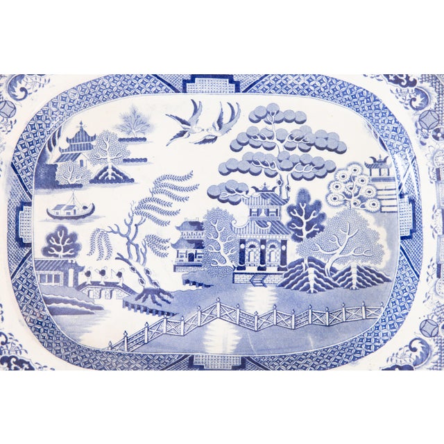 A superb antique 19th-Century English Staffordshire ironstone transferware platter in the classic Blue Willow pattern....