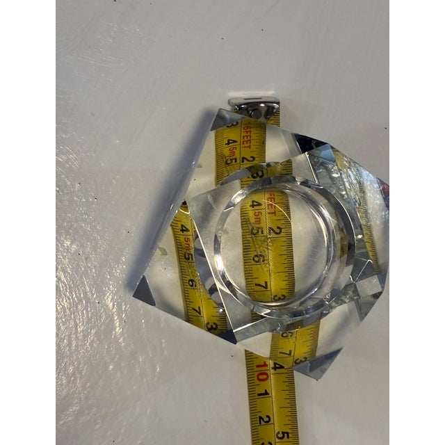 A striking complementary pair of heavy, solid crystal votive and tealight candle holders showcasing sleek mid-century to...