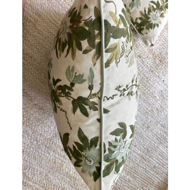 A pair of Michael S Smith Malmaison Fontaine Pillows with Samuel & Sons Mint Welt.
