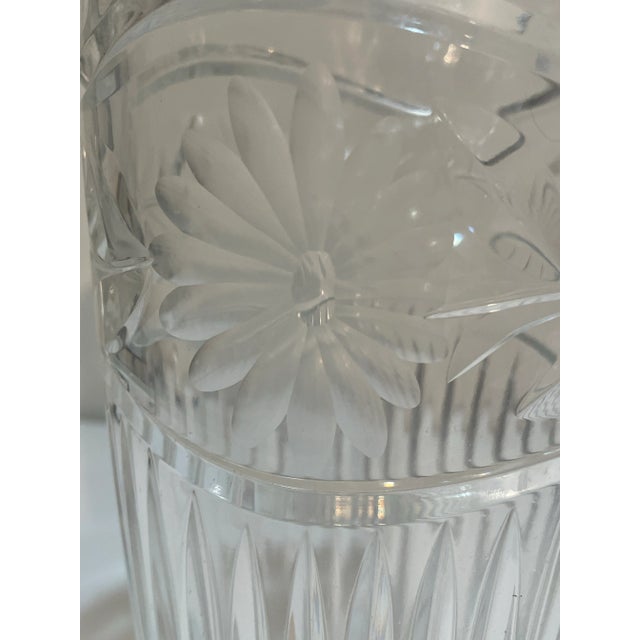 This large flower vase is hand cut from lead crystal glass, featuring a beautiful etched flower pattern. Standing at 12...