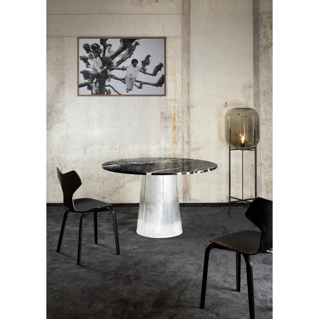 Two kinds of material united in one table. Sebastian Herkner’s fine, characteristically bent with its rippled visual has...