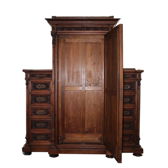 English Aesthetic Movement Armoire, c. 1880, with carved decoration depicting dragons and foliate designs, consisting of...