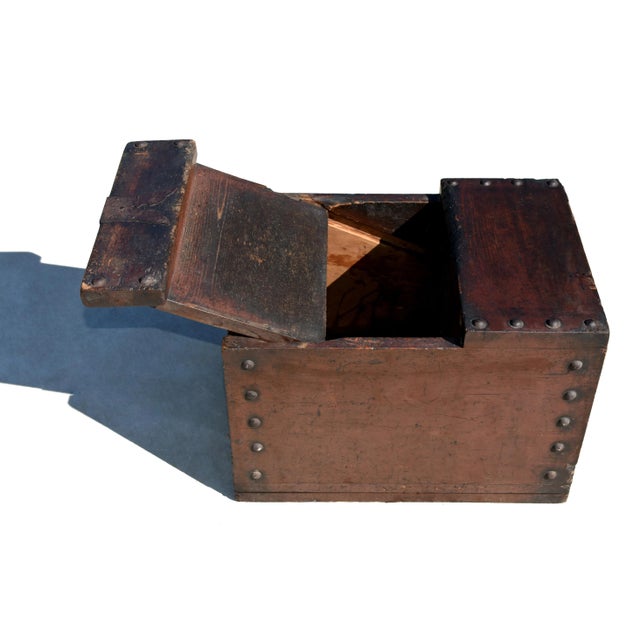 A rare antiquity from 19th century Japan, crafted from solid wood. This ingenious box features a slanted sliding panel...