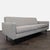 This Room and Board 3-seat sofa features a simple, modern design with clean lines and a soft gray fabric. The sofa sits on...