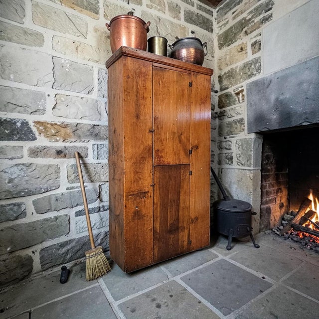 American primitive pine cupboard, late 18th to early 19th century, constructed from wide hand-planed boards and assembled...