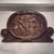 A powerful biblical relief carving showing Judith with the head of Holofernes, worked in what appears to be limewood...