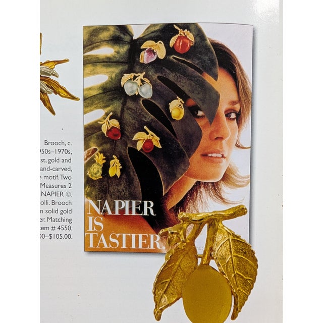 1970s textured two goldtone leaves on a stem with yellow iridescent cabochon rhinestone in the shape of a peach brooch...