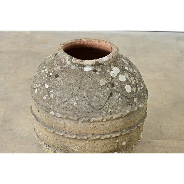 This large Spanish olive jar from the 19th century is all hand-decorated in artistic sgraffito lines and twisting ropes...
