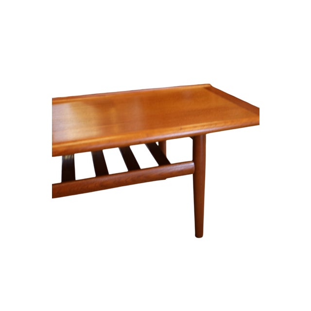 An elegant and stylish coffee table in teak, designed by the renowned Danish designer Grete Jalk for Glostrup Møbelfabrik....