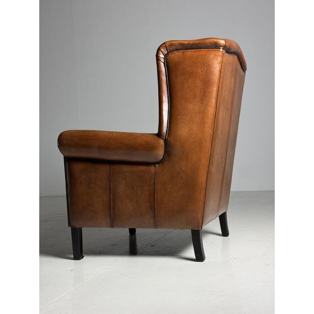 Very cool sheepskin Wingback armchair / Clubchair. In new condition! Dimensions: 86W x 85D x 108H