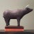 Vintage Mexican Polychrome Ceramic Bull Sculpture. Vintage ceramic bull painted in a maroon with white horns. One foot is...