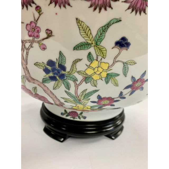 Large exquisite Chinese bowl on stand with handpainted floral decoration. Hallmarked on underside.