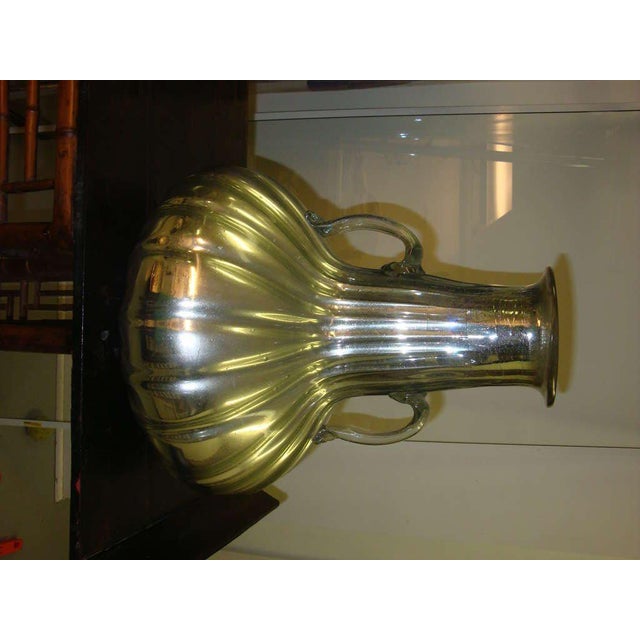 This is a Mid-Century mercury glass two handled vase probably from Mexico. MATERIALS AND TECHNIQUES: Mercury Glass