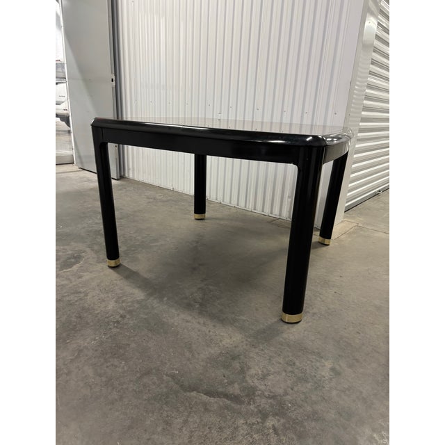 Offered is a vintage dining take by Drexel Heritage. This piece features a burl wood design with black lacquer details...