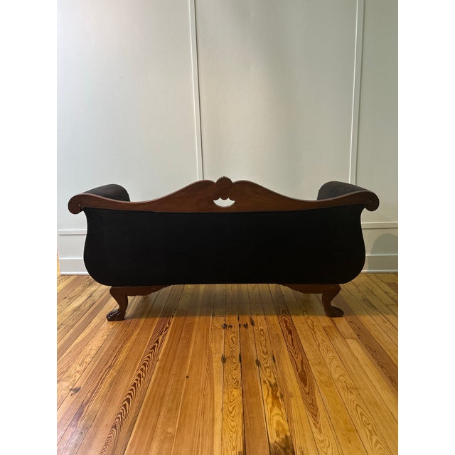 Late 19th century Victorian settee/sofa. New upholstery & interior foam. Beautiful carved mahogany frame. Claw foot legs.