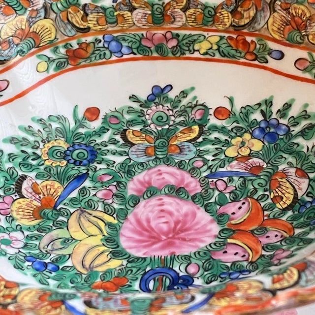 The Famille Rose Thousand Butterflies is a rare hand painted detailed design incorporating a border of butterflies around...