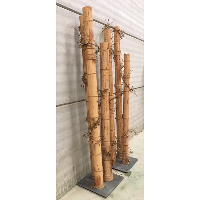 About The tall columns have a sturdy square base . Each column is decorated with a wine theme that includes leaves and...