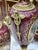 Elegant pair of French porcelain vases, decorated with a multicolored background and delicate galant scenes in reserve....