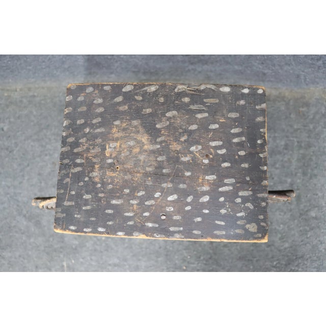 An Adirondack twig occasional table or plant stand in old black paint the rectangular top over crossed tripod legs, joined...