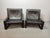 Set of two brutalist lounge chairs designed by Sonja Wasseur. Featuring black saddle leather upholstery and a black-...