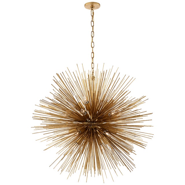 Strada Large Round Chandelier in Gild Designer: Kelly Wearstler Canopy: 4.75" Round Mounting: Chain Shade Detail: No...