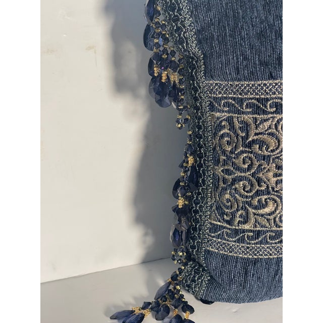 Silver silk embroidery on dark blue velvet pillow with side blue crystals beaded fringes.