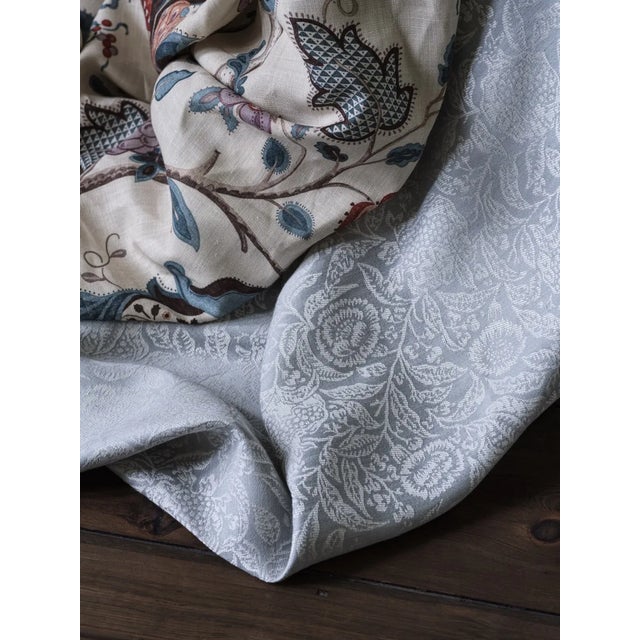 Featuring a combination of foliage flowers and pomegranates this charming woven fabric design has the handcrafted look of...