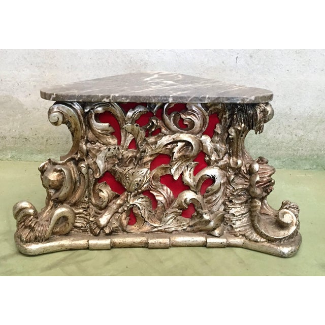 20th carved wood base, pedestal o centre, side table with marble top. The table Inside is lined with red velvet.