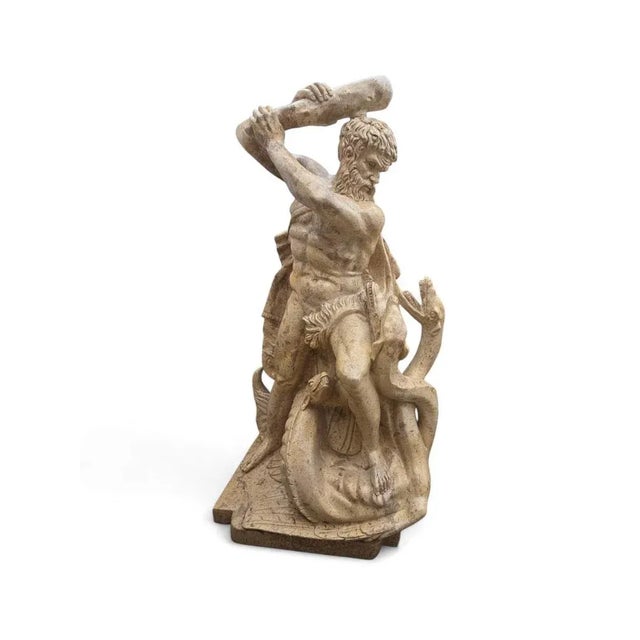 Elegant and finely carved marble sculpture depicting Hercules as a child fighting the serpents, a classic scene from Greek...