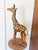 This charming leather-wrapped giraffe sculpture brings a touch of safari-inspired decor to any space, with hand-painted...