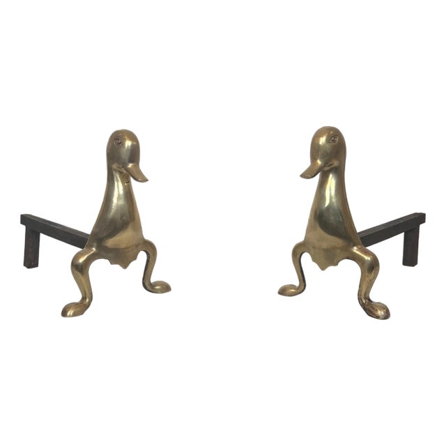 Pair of stylized brass andirons in the style of Claude and For Sale