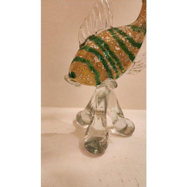 This listing features a beautiful yellow and green striped fish with silver leaf flake details.
