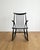 Rocking chair, designed by Illum Wikkelsø, Danish, 1950s. Black lacquered wood frame with a high backrest featuring turned...