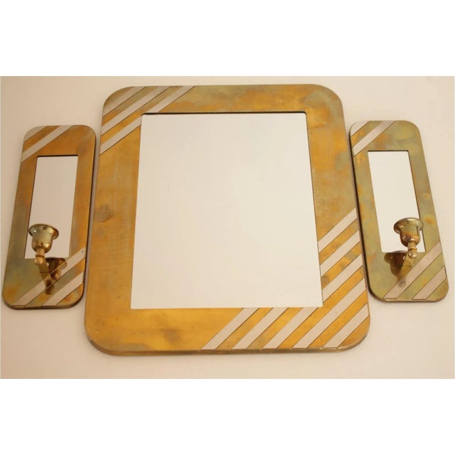A unique and glamorous set of 3 mirrors by House of Lloyd from 1989. They are constructed of brass & chrome. The two side...