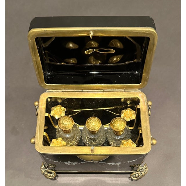 Exquisite piece of Mary Gregory all original black amethyst glass hinged perfume box. Inside is formed with gilt wire...