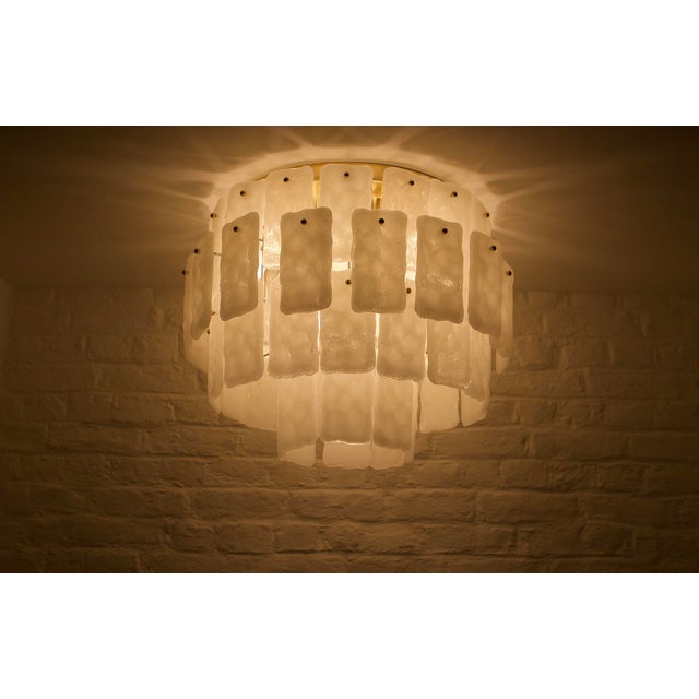 Large brass and Murano glass ceiling light, decorated with 64 translucent white glass plates, spread over 3 levels,...