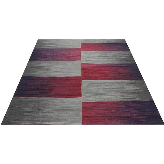 ACTUAL SIZE: 5’4″ x 6’6″ PRIMARY COLOR: Gray / Red AGE: New MATERIALS: Wool FOUNDATION: Cotton PRODUCTION: Handwoven, Flat...
