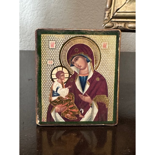 This exquisite miniature Orthodox icon depicts the Virgin Mary and Christ Child, beautifully rendered in traditional hand-...